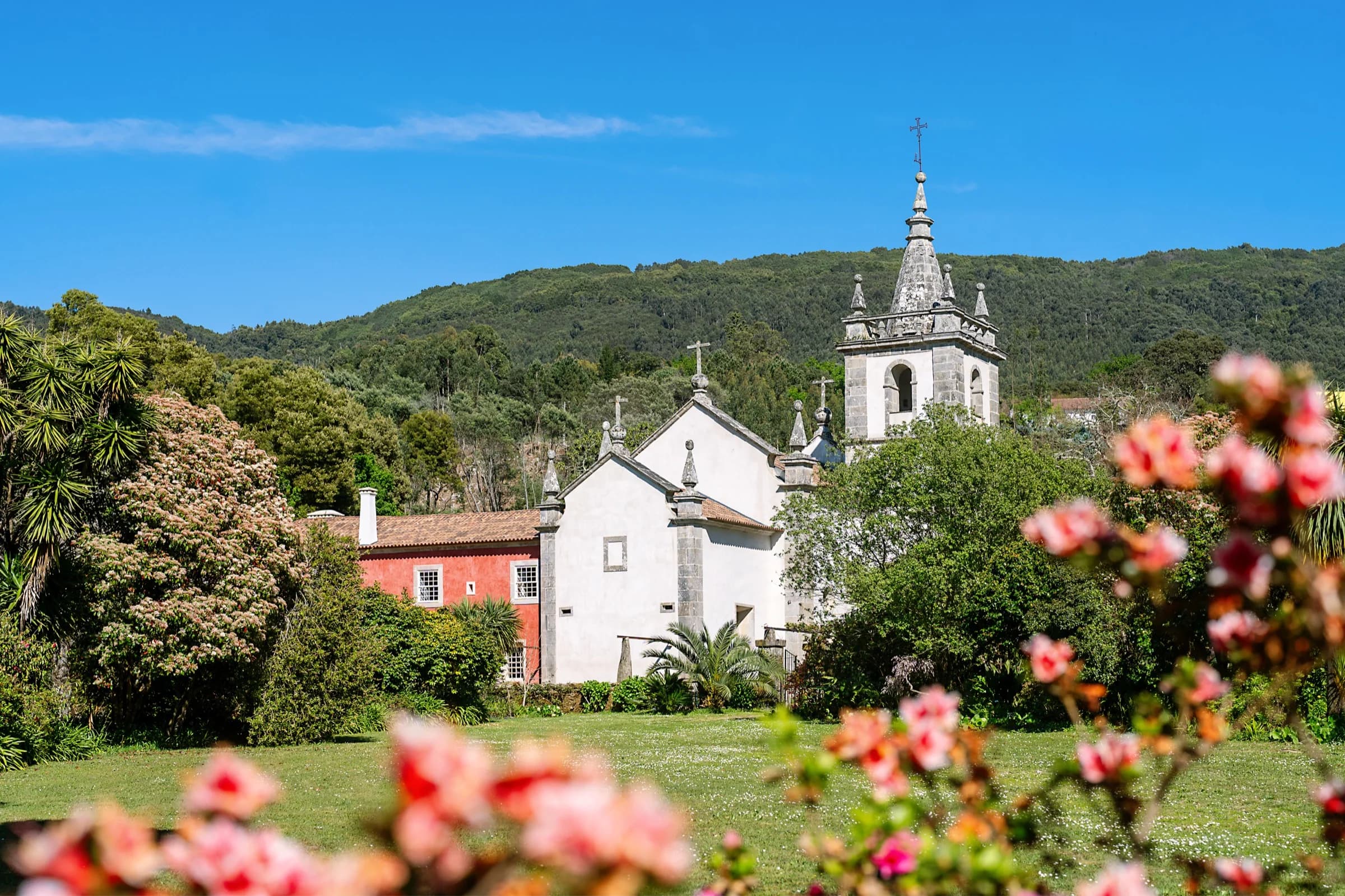 The Convento church seen through the flowering gardens